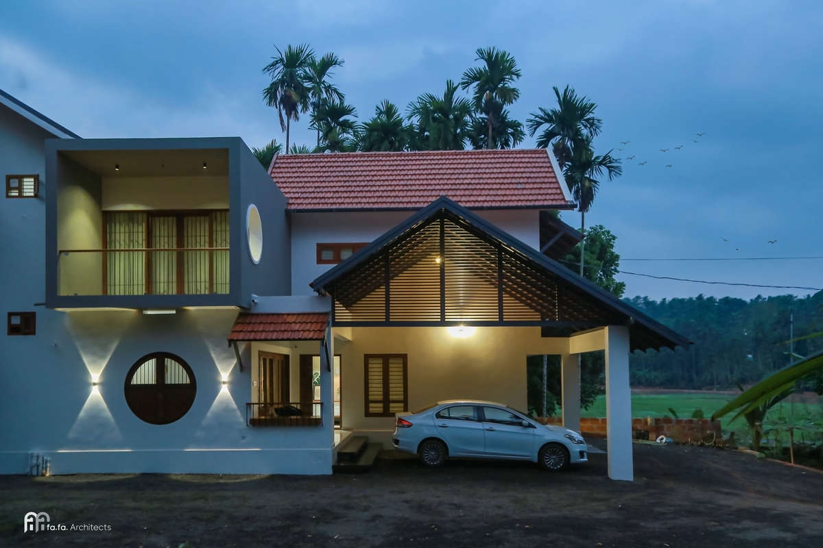 2750 Sqft | Vazhakkad, India

Client: Shameem ok & Shamla hamza
Project Category: Residential
Plot Area: 23 Cents
Area: 2750 Sqft
Location: Vazhakkad, India

Architect: fafa Architects, Calicut, India
@fafa.architects
Contact: +91 8086701493, +91 9567587306
email: fafa.architects@gmail.com

Awaaz is a tropical modern Kerala residence located in the Malabar region of Kerala with an Built up Area 2750 Sq.Ft. The house is planned in a linear arrangement, according to site conditions. The 23 cent site has a wide view of green field, which is utilized by giving patios and balconies. The house has 4 attached bedrooms, with a central courtyard to which every door of the house opens. The skylight courtyard gives enough ambient lighting inside common spaces. The green indoor courtyard is the central attraction of the house. The open theme concept we adopted here lets the flow of enough light inside the house.

Kolo - Indiaâ€™s Largest Home Construction Community ðŸ� 

#home #keralahouse #residence