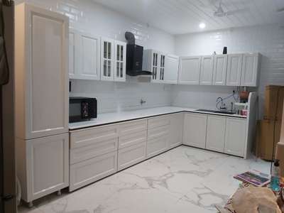 Kitchen, Flooring, Storage Designs by Interior Designer CABINET stories 9495011585, Thrissur | Kolo