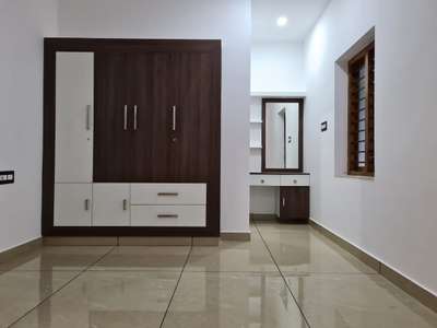 Storage, Lighting, Flooring Designs by Contractor Biju K V, Thrissur | Kolo
